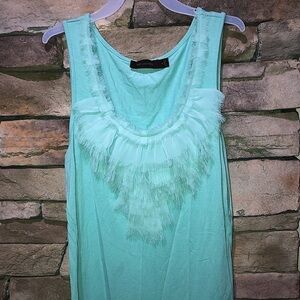 The limited size medium top with ruffle trim